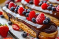 Fruit and Berry Eclair Cakes, Delicious Fruits Milk Dessert, Chocolate Mirror Glazed Eclairs Royalty Free Stock Photo