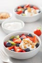 Fruit berry salad with yogurt and granola for healthy breakfast