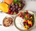 Fruit berry salad with yogurt and granola for healthy breakfast