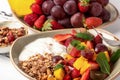 Fruit berry salad with yogurt and granola for healthy breakfast