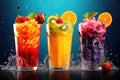 Fruit and berry smoothies in glasses with splashes on blue background, Fruit smoothies in glass with colorful splashes. Mixed Royalty Free Stock Photo