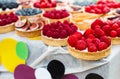 Fruit and berry tarts dessert tray assorted outdoors Royalty Free Stock Photo