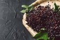 Fruit black elderberry on a dark background. Sambucus nigra. European black elderberry background