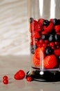 Fruit in a blender, mixer. Fruit cocktail and healthy food and drinks. Strawberry, raspberry, blueberry. Diet and vitamins for Royalty Free Stock Photo