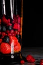 Fruit in a blender, mixer. Fruit cocktail and healthy food and drinks. Strawberry, raspberry, blueberry. Diet and vitamins for Royalty Free Stock Photo