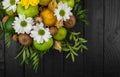 Fruit bouquet with apples, yellow flowers, kiwi fruit and avocado.