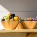 Fruit Bowl And Colorful Straws On Table Royalty Free Stock Photo
