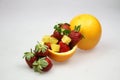 a fruit bowl with strawberries, oranges, and slice of star fruit Royalty Free Stock Photo