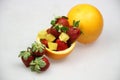 a fruit bowl with strawberries, oranges, and slice of star fruit Royalty Free Stock Photo