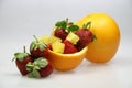 a fruit bowl with strawberries, oranges, and slice of star fruit Royalty Free Stock Photo