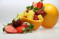 a fruit bowl with strawberries, oranges, and slice of star fruit Royalty Free Stock Photo