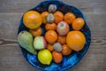Fruit bowl with a wooden background Royalty Free Stock Photo
