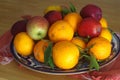 Fruit bowls filled with various types of fruit, tangerine mandarin oranges apples pears Royalty Free Stock Photo