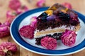 Fruit cake with chocolate meringue white cream in a plate Royalty Free Stock Photo