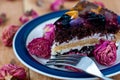 Fruit cake with chocolate meringue white cream in a plate Royalty Free Stock Photo