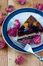 Fruit cake with chocolate meringue white cream in a plate Royalty Free Stock Photo