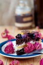 Fruit cake with chocolate meringue white cream in a plate Royalty Free Stock Photo