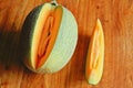 Details of cut cantaloupe on dining table Royalty Free Stock Photo