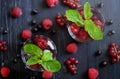 Fruit coctaile and color berries on natural dark wooden desk