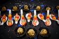 Fruit coloured desserts on the spoons close-up Royalty Free Stock Photo
