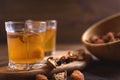 Fruit compote in glass cups on wooden background. Selective focus Royalty Free Stock Photo