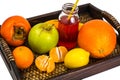 Fruit, cookies, nuts, wooden tray, white background Royalty Free Stock Photo