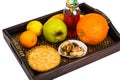 Fruit, cookies, nuts, wooden tray, white background Royalty Free Stock Photo