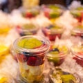 Fruit counted in individual containers ready for consumption and preserved with ice, Mercado de San Miguel, Madrid.