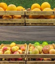Fruit crates with oranges and apples