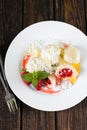 Fruit damplings with two strawberries and melissa leaves Royalty Free Stock Photo