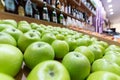 Fruit display with green apples in a store