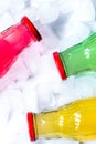 fruit drinks in colorful plastic bottles with ice top view mock-up Royalty Free Stock Photo