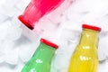 Fruit drinks in colorful plastic bottles with ice top view mock-up Royalty Free Stock Photo