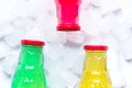 Fruit drinks in colorful plastic bottles with ice top view mock-up Royalty Free Stock Photo