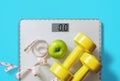 Fruit, dumbbell and scale, fat burn and weight loss concept