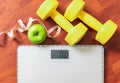 Fruit, dumbbell and scale, fat burn and weight loss concept Royalty Free Stock Photo