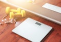 Fruit, dumbbell and scale, fat burn and weight loss concept Royalty Free Stock Photo