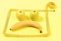 Fruit face with sad expression framed with measuring tape Royalty Free Stock Photo