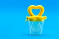 Fruit feeder for feeding weaned babies. Royalty Free Stock Photo