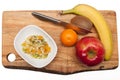 Fruit and fruit salad on cutting board