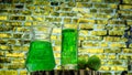 Fruit green drink in a glass against a brick wall background, green lemonade in a glass with lime. Summer drink with ice Royalty Free Stock Photo