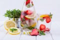 Fruit and herb infused water. Cold refreshing vitamin detox water. Royalty Free Stock Photo