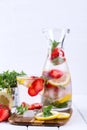 Fruit and herb infused water. Cold refreshing vitamin detox water. Royalty Free Stock Photo