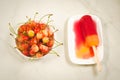 Fruit ice cream and bowl with sweet cherry/fruit ice cream and bowl with sweet cherry on a white background, top view Royalty Free Stock Photo