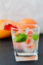 Fruit in ice cubes in water