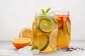 Fruit ice tea and ginger herbal ice tea with mint in a glass jar Royalty Free Stock Photo