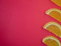 Fruit jelly in the form of orange and grapefruit slices on a red background.Sweets on the table Royalty Free Stock Photo