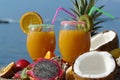 Fruit juice on the beach Royalty Free Stock Photo