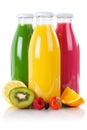 Fruit juice smoothie fruits smoothies in bottle vertical isolate Royalty Free Stock Photo