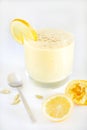 Fruit juice smoothie or milkshake with lemon and cardamom Royalty Free Stock Photo
